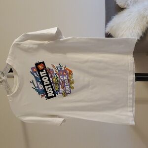 The Nike Tee kid's size XL, just do it, colorful design on front